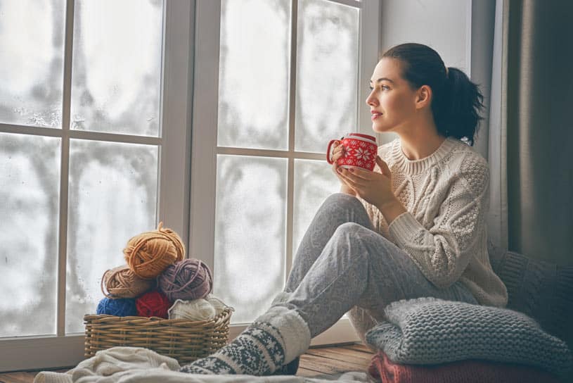homepage-window-innnovation-woman-looking-out-window